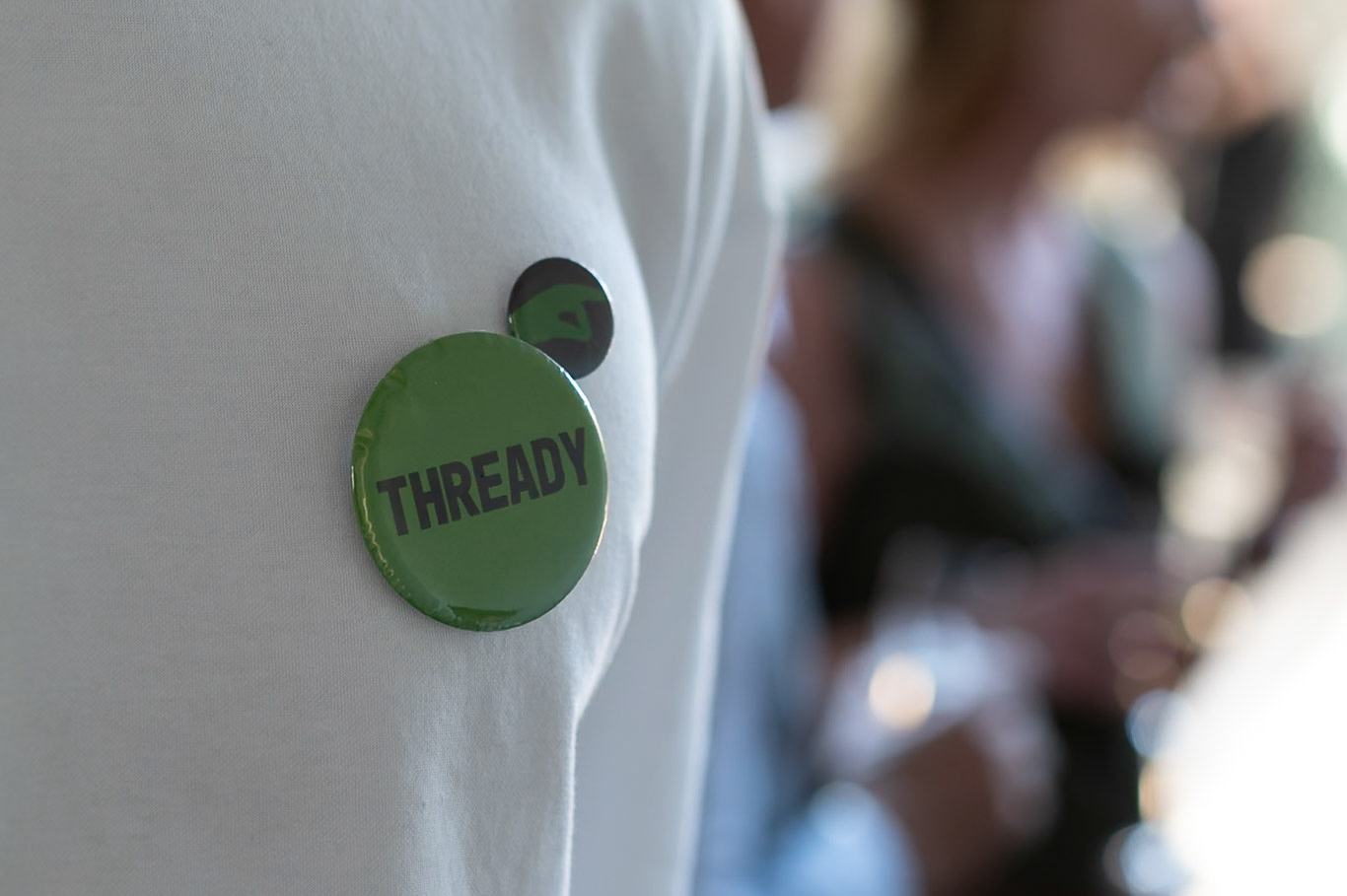 Badges worn by student ushers at Threads of Belonging Opening Night at Woodleigh School